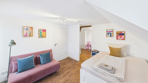 Schlaf- und Wohnzimmer Apartment 4. OG - 