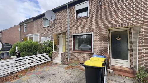 Ausenansicht - Charmantes Reihenmittelhaus mit Wintergarten, Garage und gepflegtem Garten attraktive Kapitalanlage