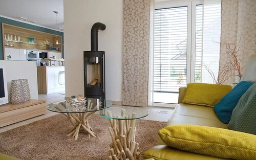 Wohnbereich mit Kamin - Bungalow mit 98,74 m&sup2; in Gründau zum Kaufen