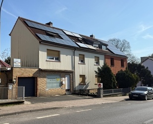 Mehrfamilienhaus mit Ladeneinheit und Entwicklungspotenzial auf großzügigem Grundstück in Frankfurt-Nieder Eschbach - Frankfurt am Main