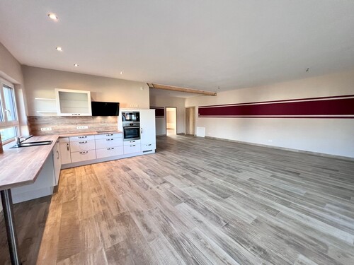 Wohnzimmer mit offener Küche - Einfamilienhaus mit 113,00 m² in Boldekow zum Kaufen