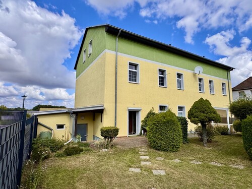 Hausansicht hinten - 2 Zimmer Etagenwohnung zum Kaufen in Tantow