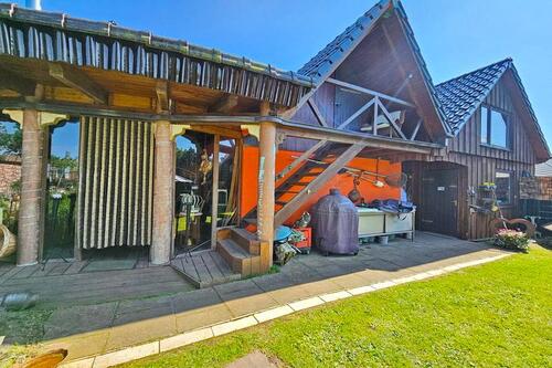 Blick auf Wintergarten Grillbereich und Werkstatt - 