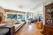 Wohnzimmer - Einfamilienhaus mit 160,92 m&sup2; in München zum Kaufen